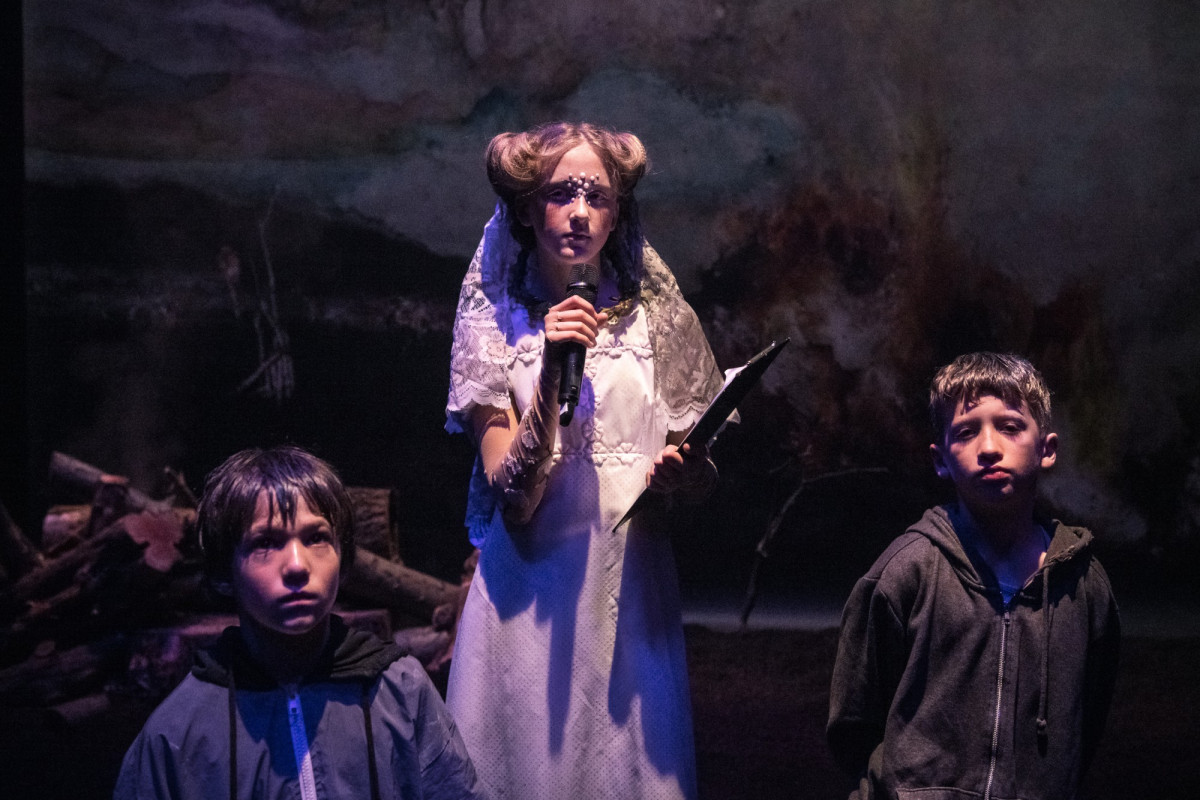 Three children in futuristic costumes